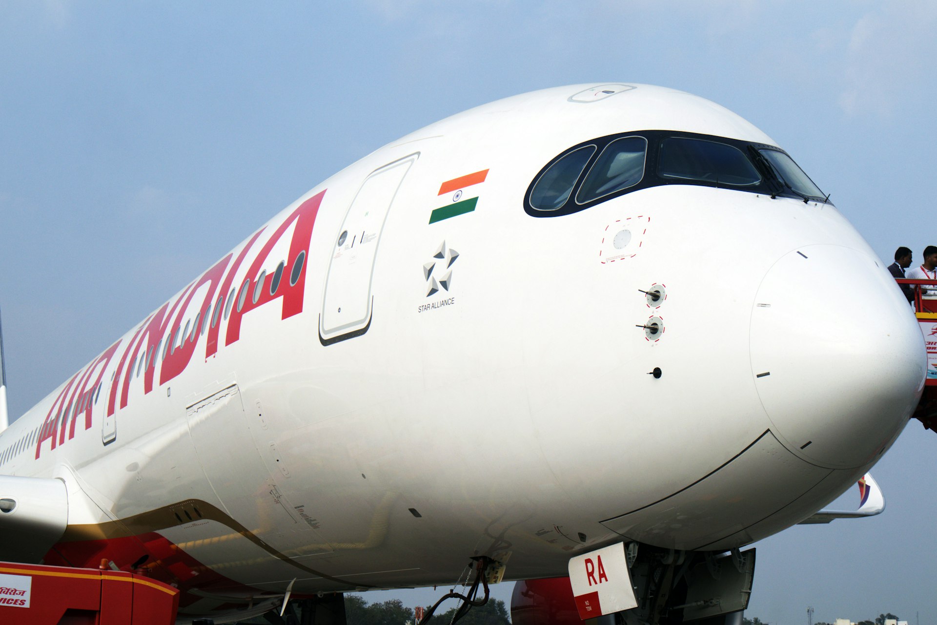 A large jetliner sitting on top of an airport tarmac